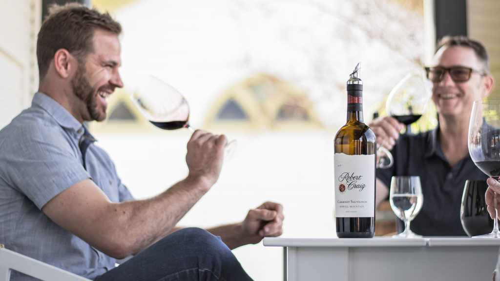 People tasting red wine on the Robert Craig Winery Tasting Salon Porch